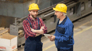 manager talking to employee in warehouse